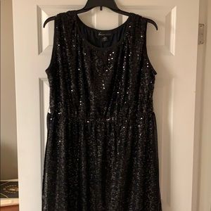 Sequined formal dress with ribbon sash.